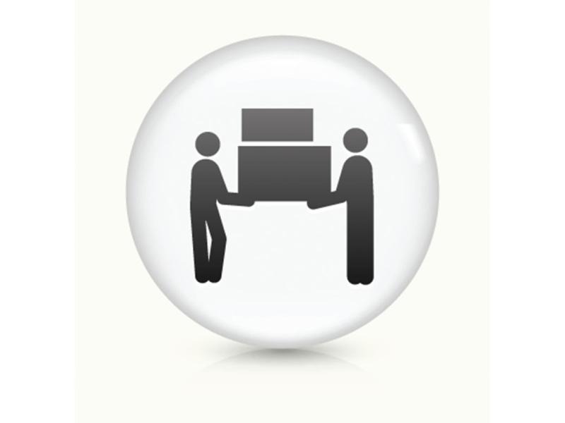 Two figures moving furniture