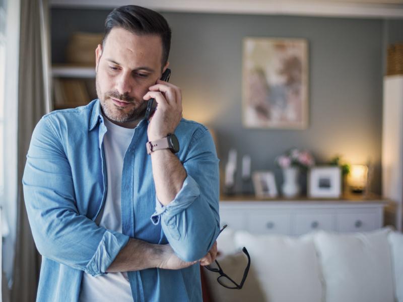 Man listens on a phone