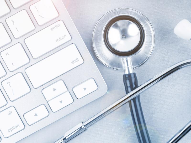 Stethoscope next to keyboard