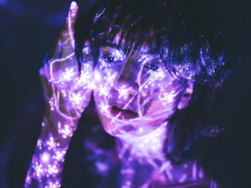 Person colored with bright psychedelic paint