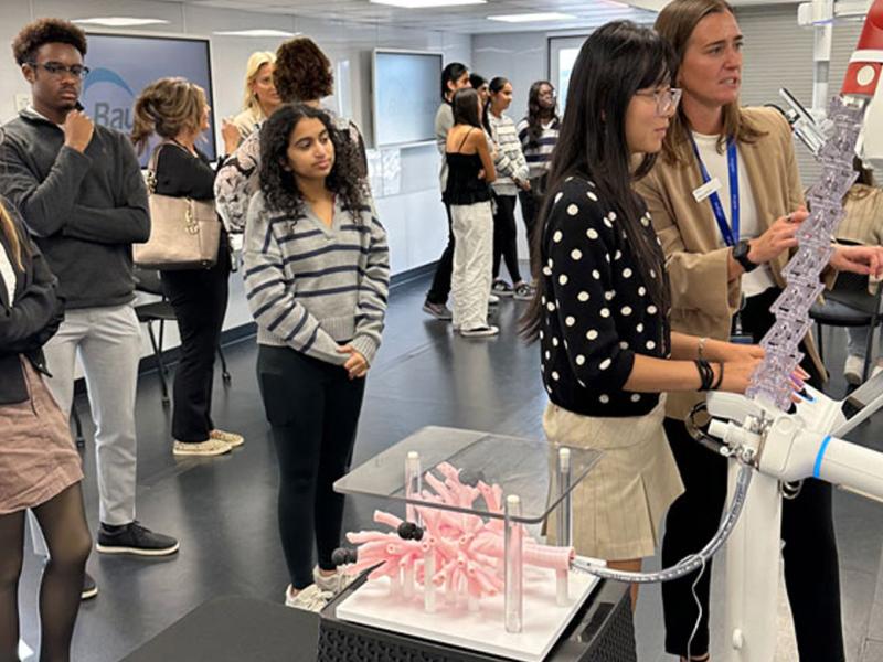 A high school student drives the Ion through artificial lungs in the TOME Truck