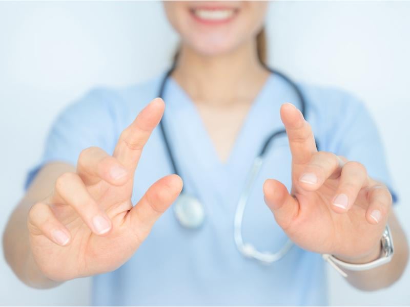 Health care worker with pointing gesture