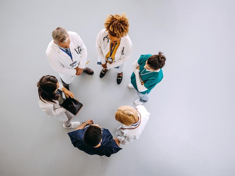 Health care workers in a circle