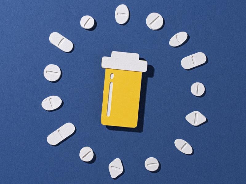 Prescription pill bottle with pills surrounded in a circle