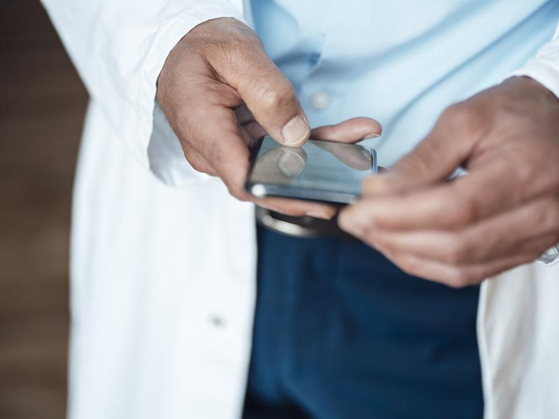 Hands hold a smartphone