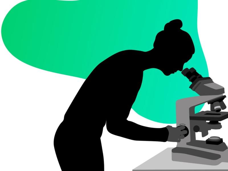 Figure looking through a microscope