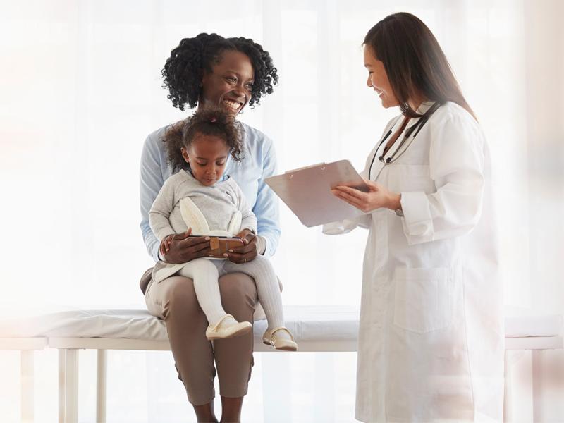 Mother and child consulting with a pediatrician