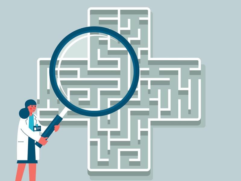 Figure holds giant magnifying glass over a maze