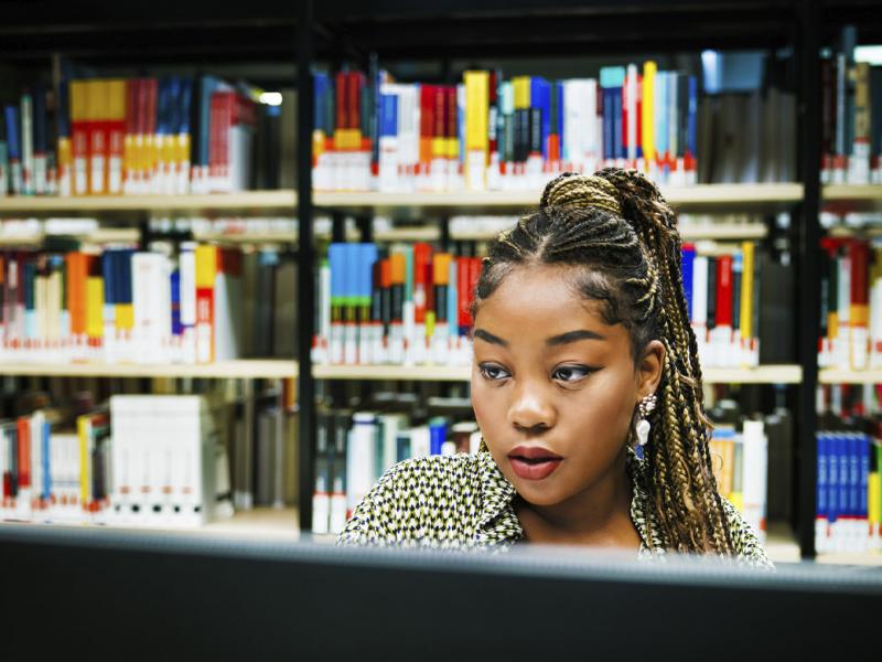 Woman studying in a library