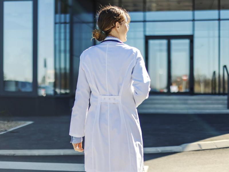 Doctor walking towards building