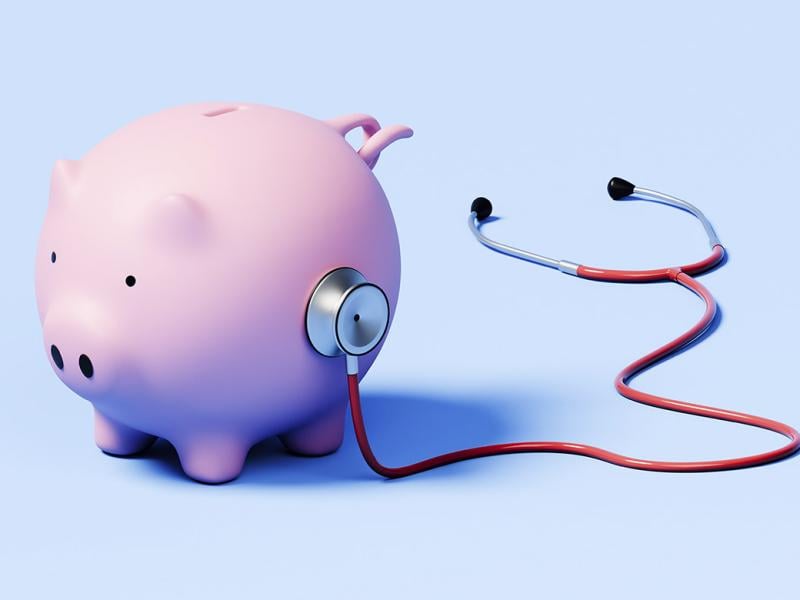 Stethoscope on a piggy bank