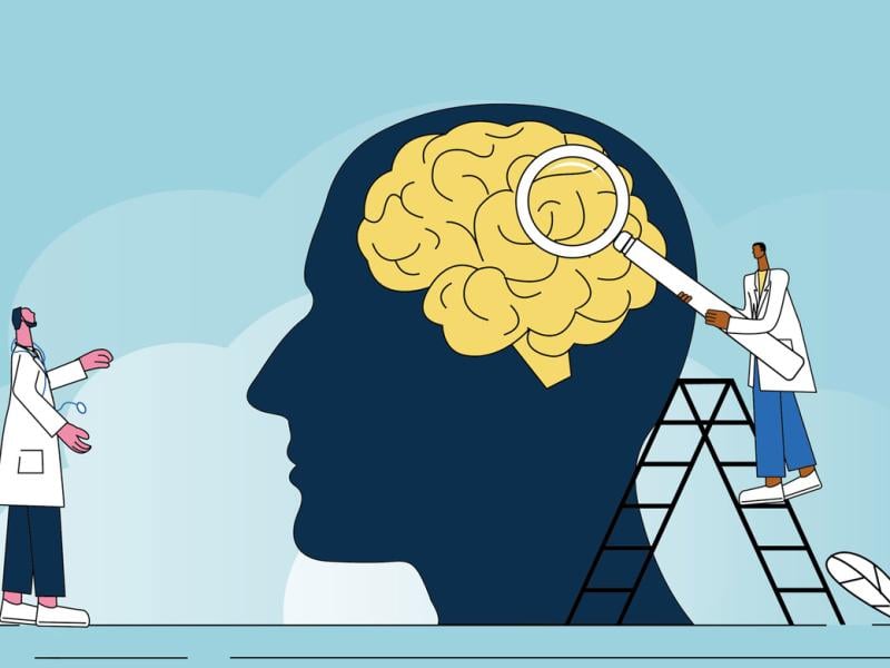 Two figures examine a giant brain