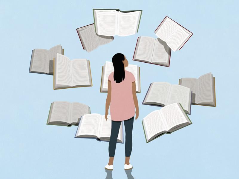 Figure surrounded by books