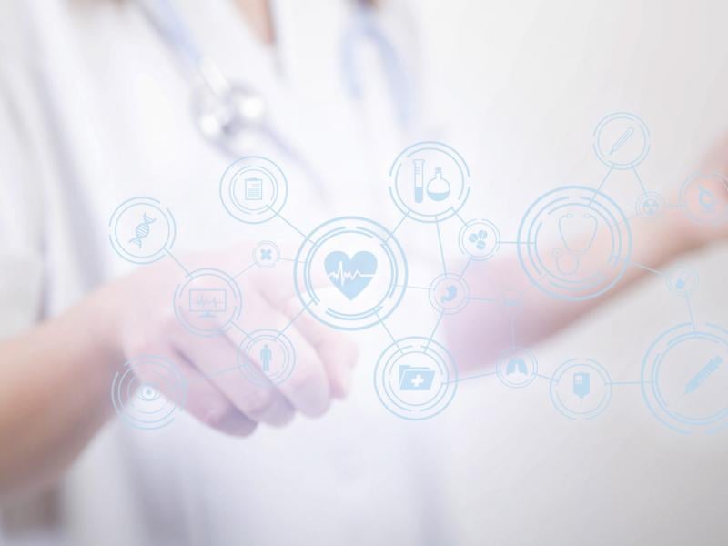 Physician points to virtual health icons