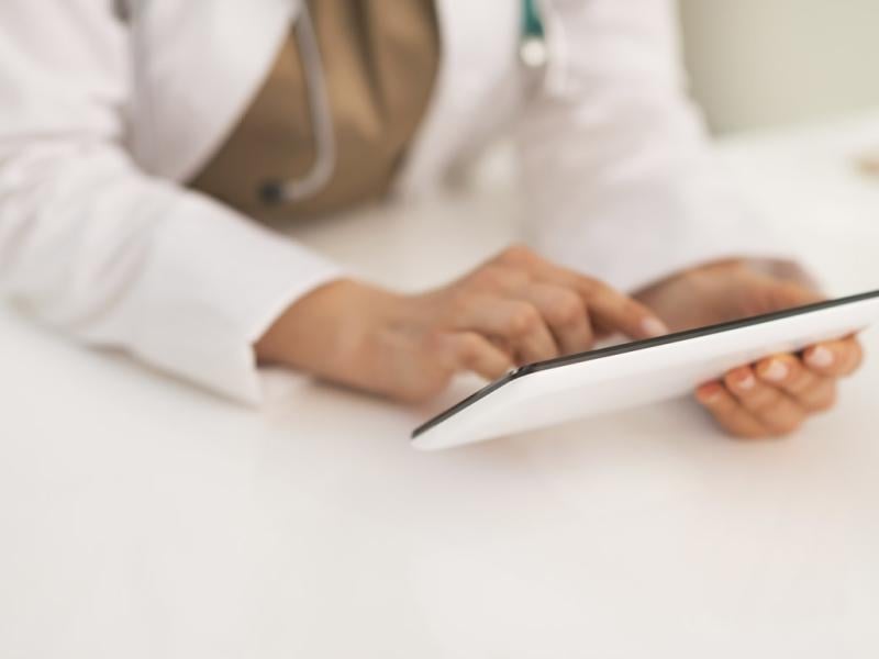 Physician uses a tablet