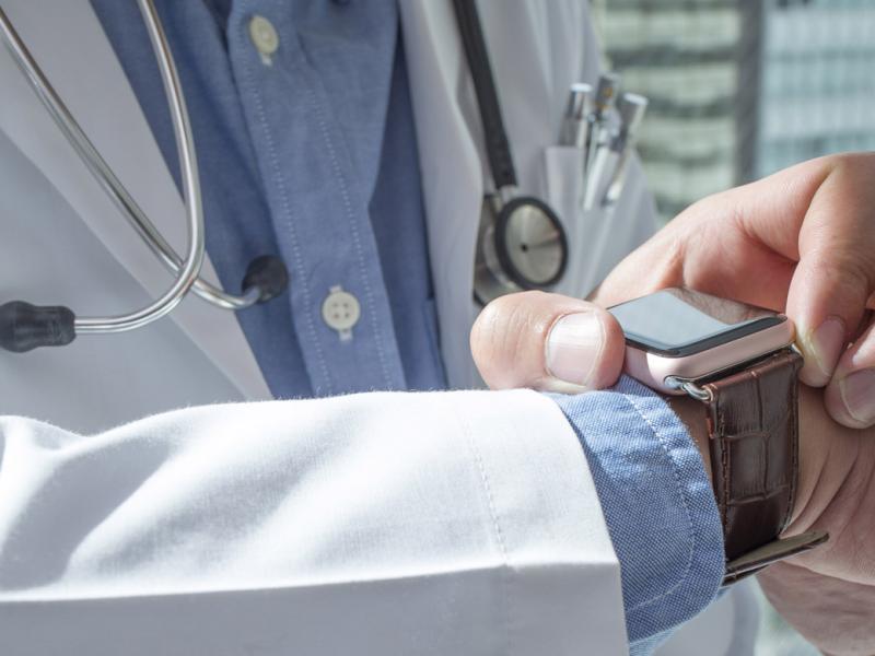 Doctor using smartwatch