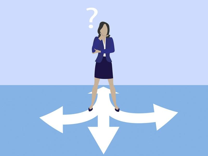 Figure stands in front of arrows pointing in different directions