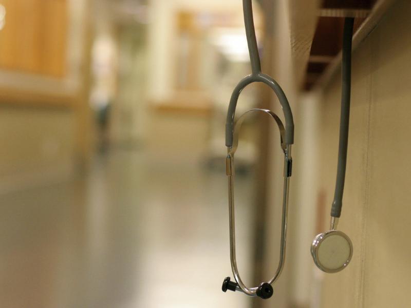 Stethoscope hanging on railing inside hospital