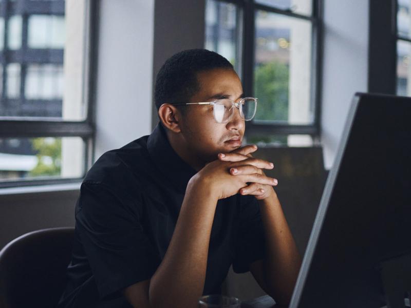 Young businessperson working on a laptop computer