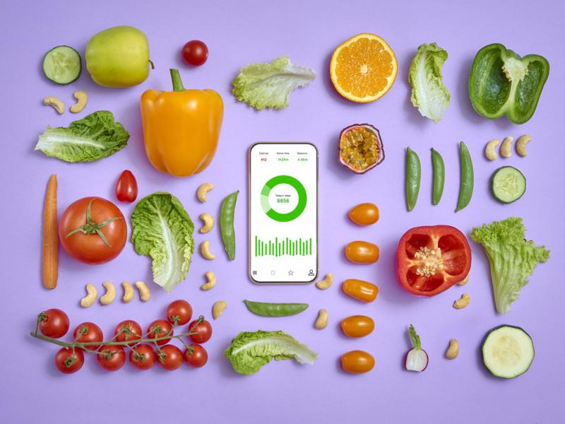 Fruits and vegetables surround smartphone
