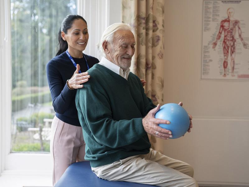 Physical therapist with patient
