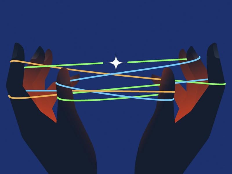 Hands holding string in cat's cradle