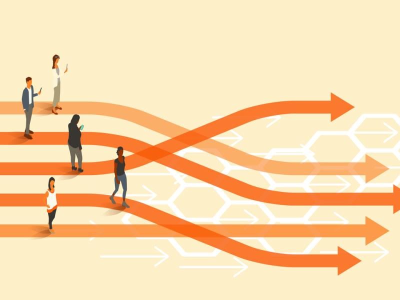 Four people stand at winding paths