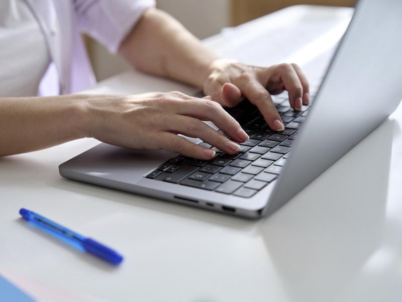Hands on a laptop