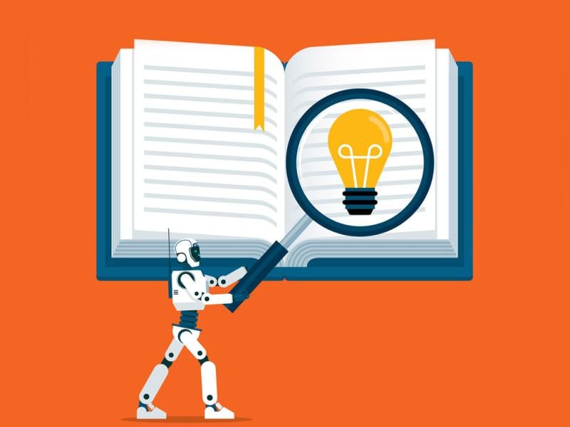 Robot with giant magnifying glass over a textbook