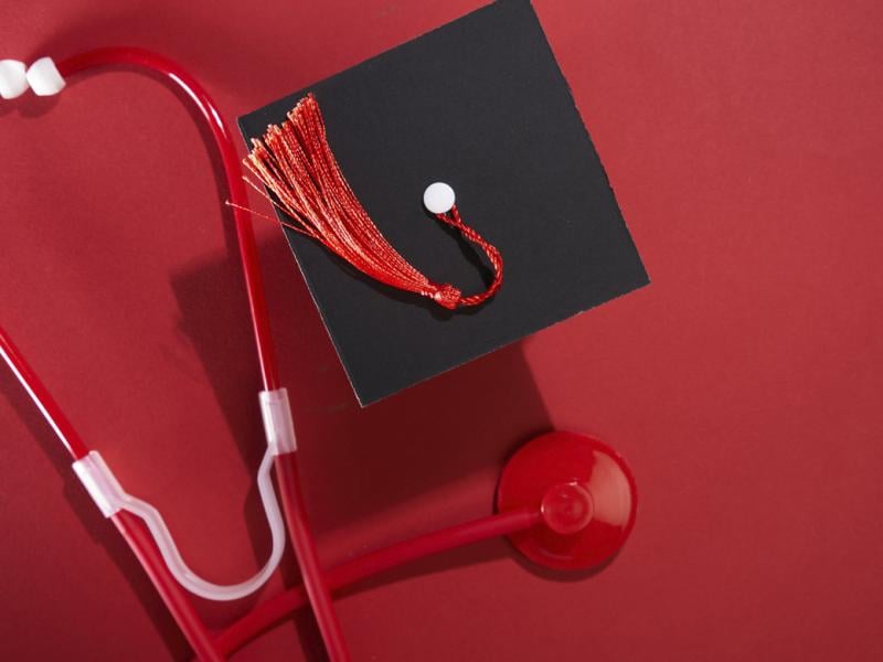 Graduation cap next to stethoscope