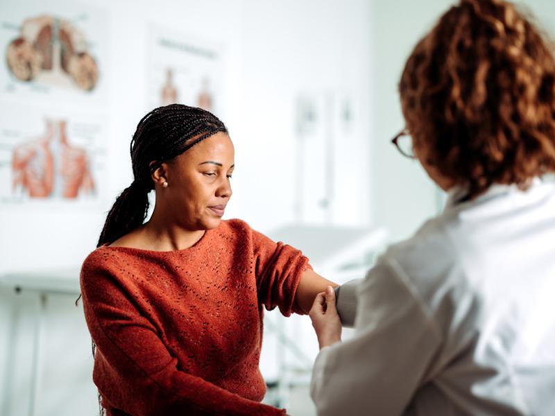Patient getting blood pressure checked during doctor's appointment