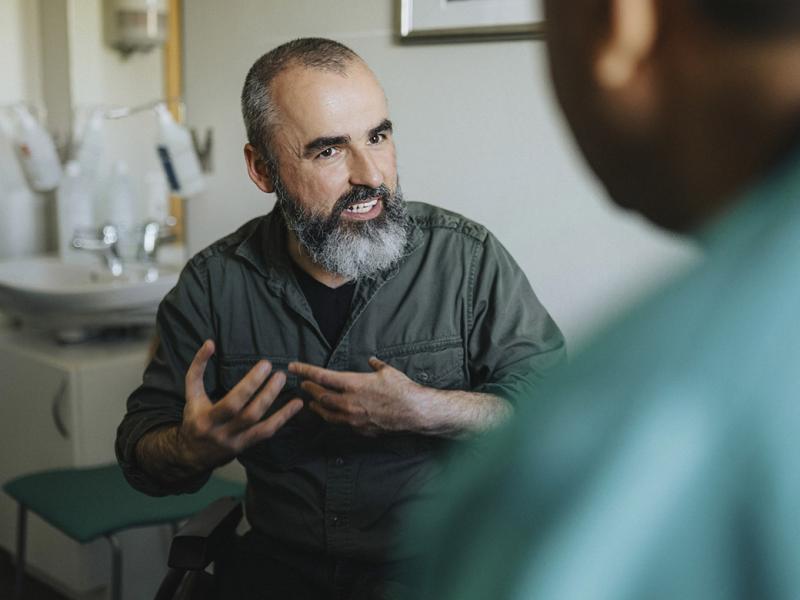 Patient speaks with healthcare worker