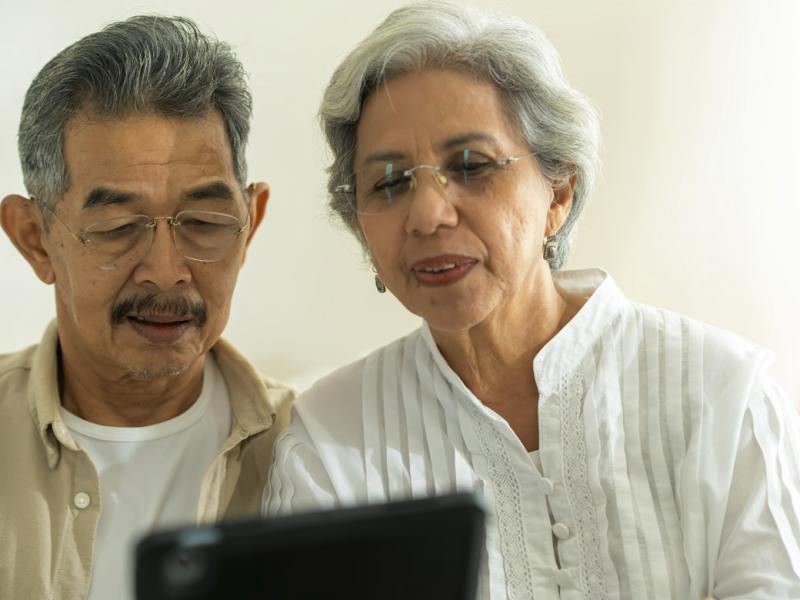 Couple looks at a tablet