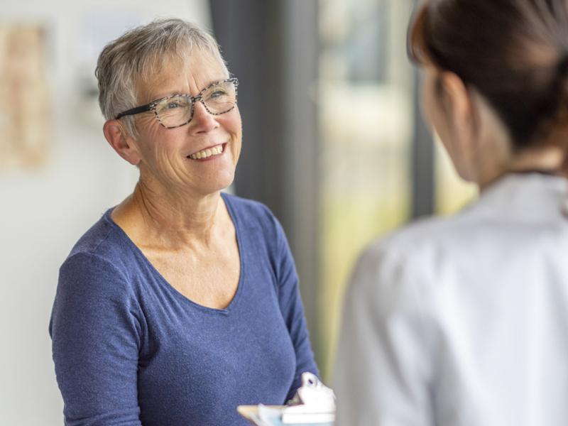 Older adult speaks with physician