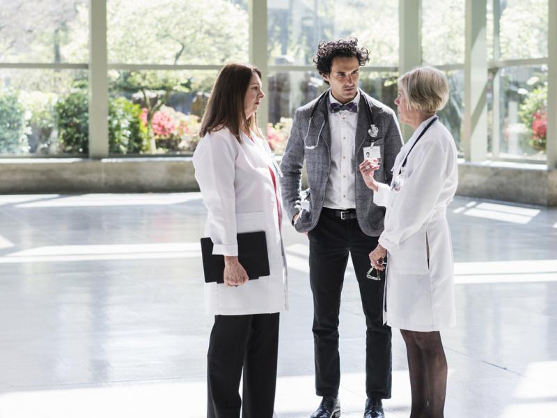 Three physicians in discussion