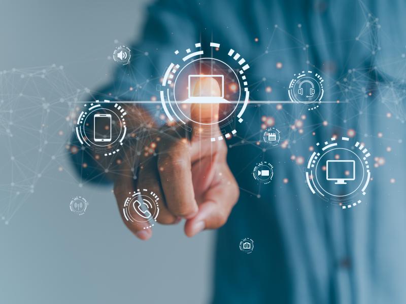 Finger reaches out toward virtual icons