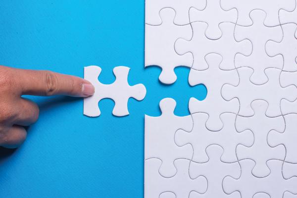 Finger on a missing puzzle piece