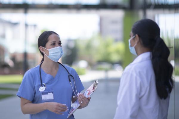 Health care workers in conversation