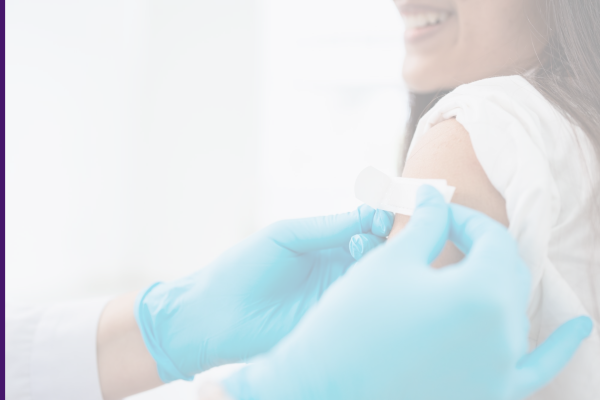 Hand places bandage on patient's arm