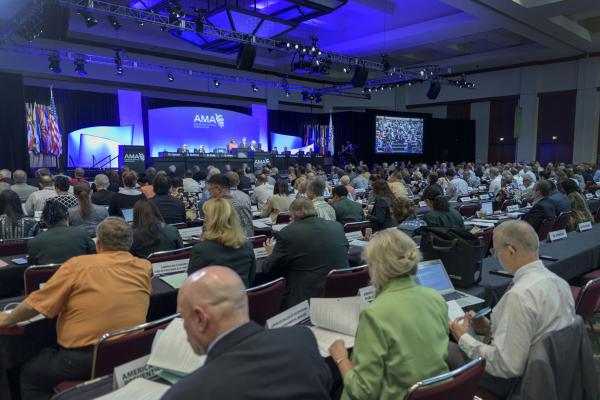 A photo of the meeting room filled with people for the 2018 AMA Annual Meeting.