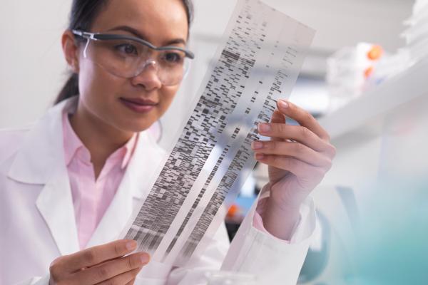 Physician reviews test chart. 