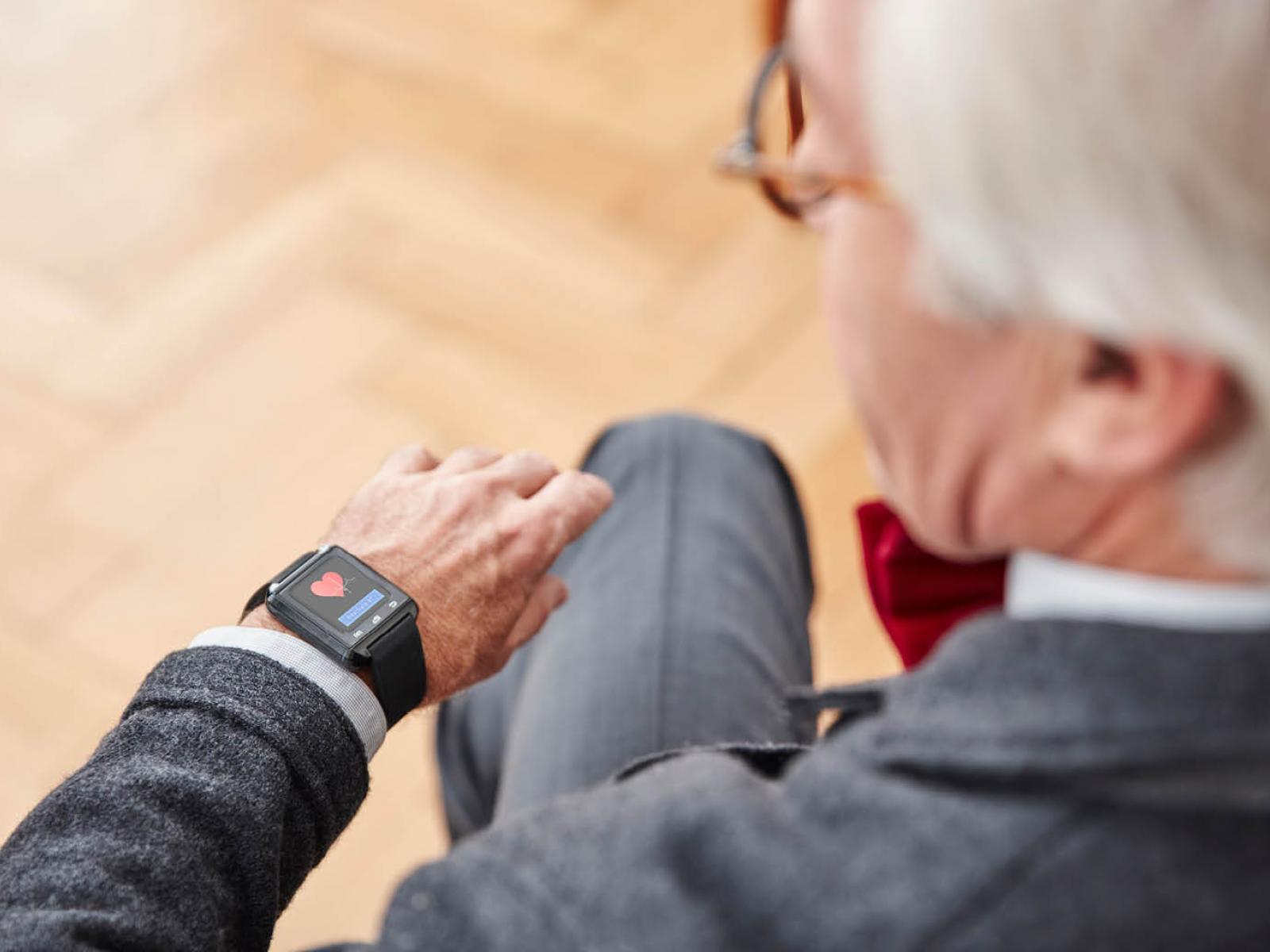 Man looking at wearable device