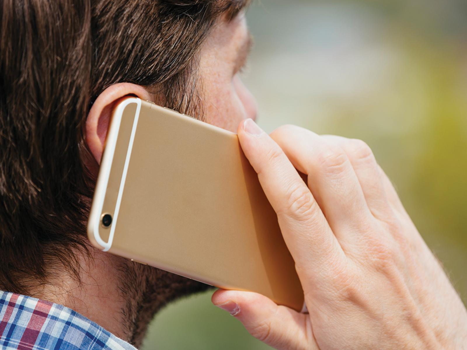 Man with cell phone to his ear