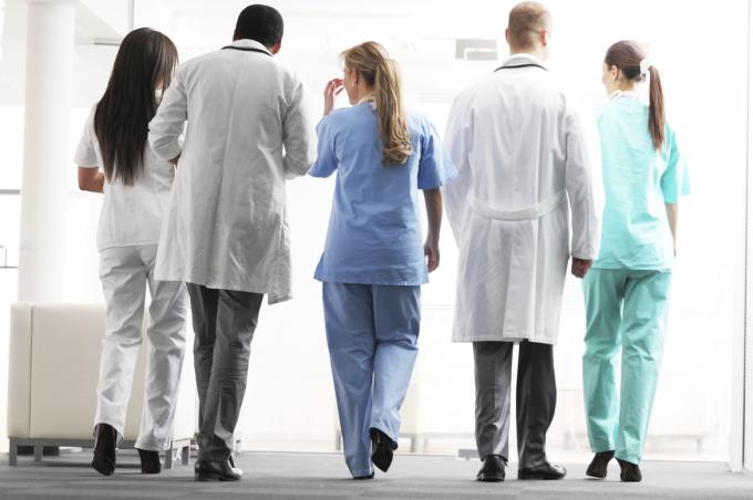 A group of hospital teams, doctors and nurses walking together