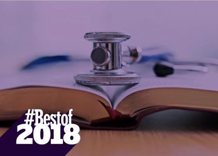 Stethoscope on top of open textbook