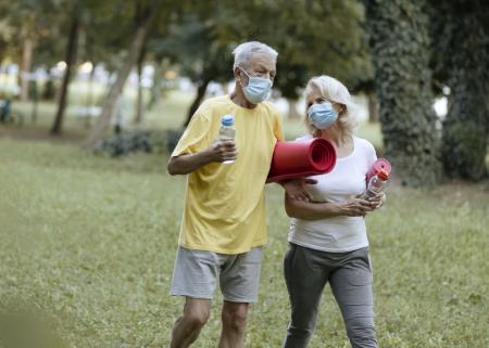 Couple wearing face masks outside
