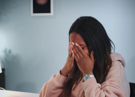 Person with hands on head