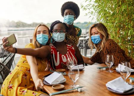 Group of people taking a photo with a smartphone