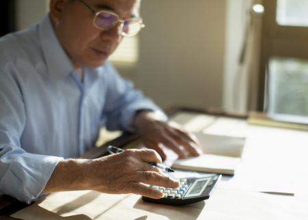 Person working on a calculator