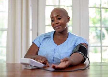 Person monitoring blood pressure